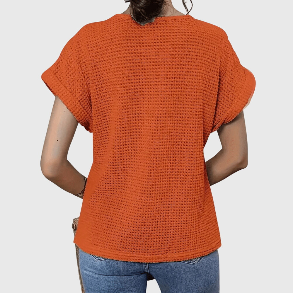 Textured perforated geometric loose top with rolled-up sleeves