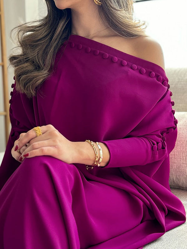 Maxi dress with an asymmetrical neckline and shoulder slit