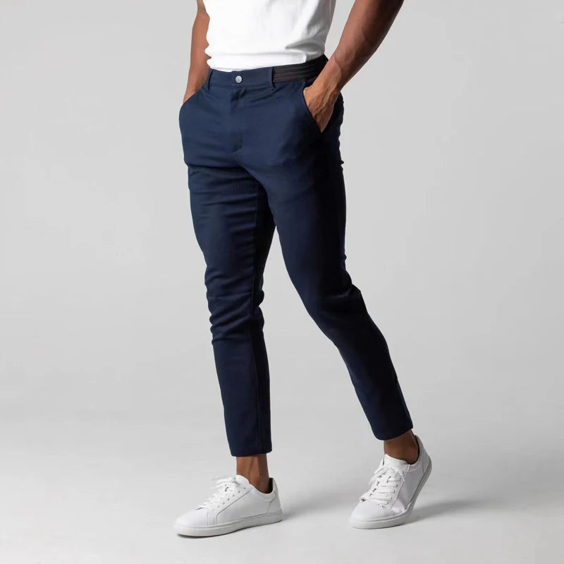 Tapered slim-fit pants with pockets, a button, and finished hems