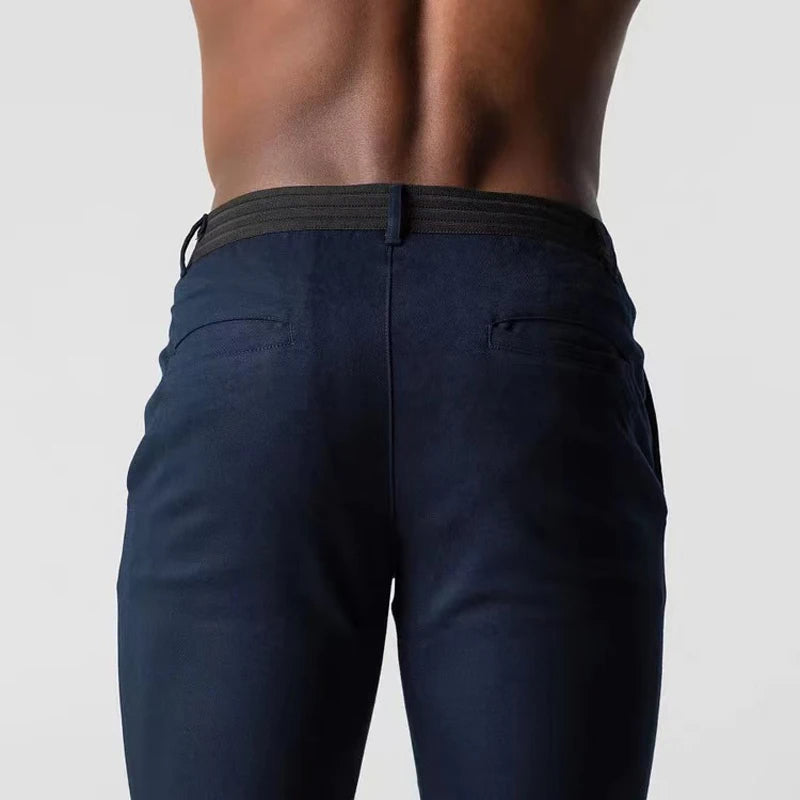 Tapered slim-fit pants with pockets, a button, and finished hems