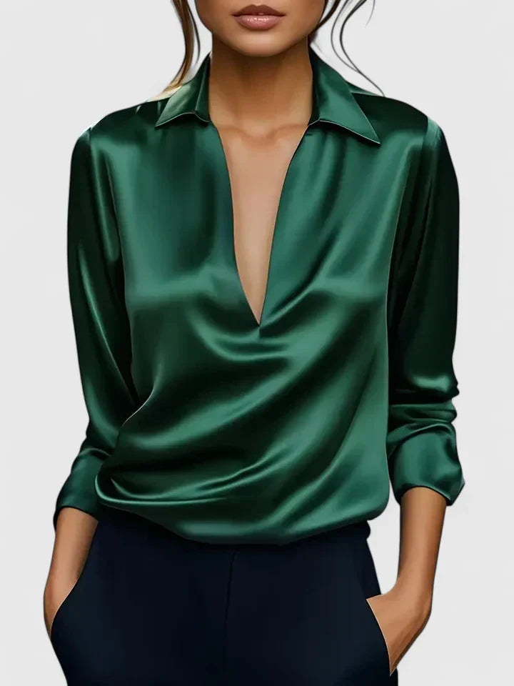 Solid-color V-neck top with draped sleeves and cuffs