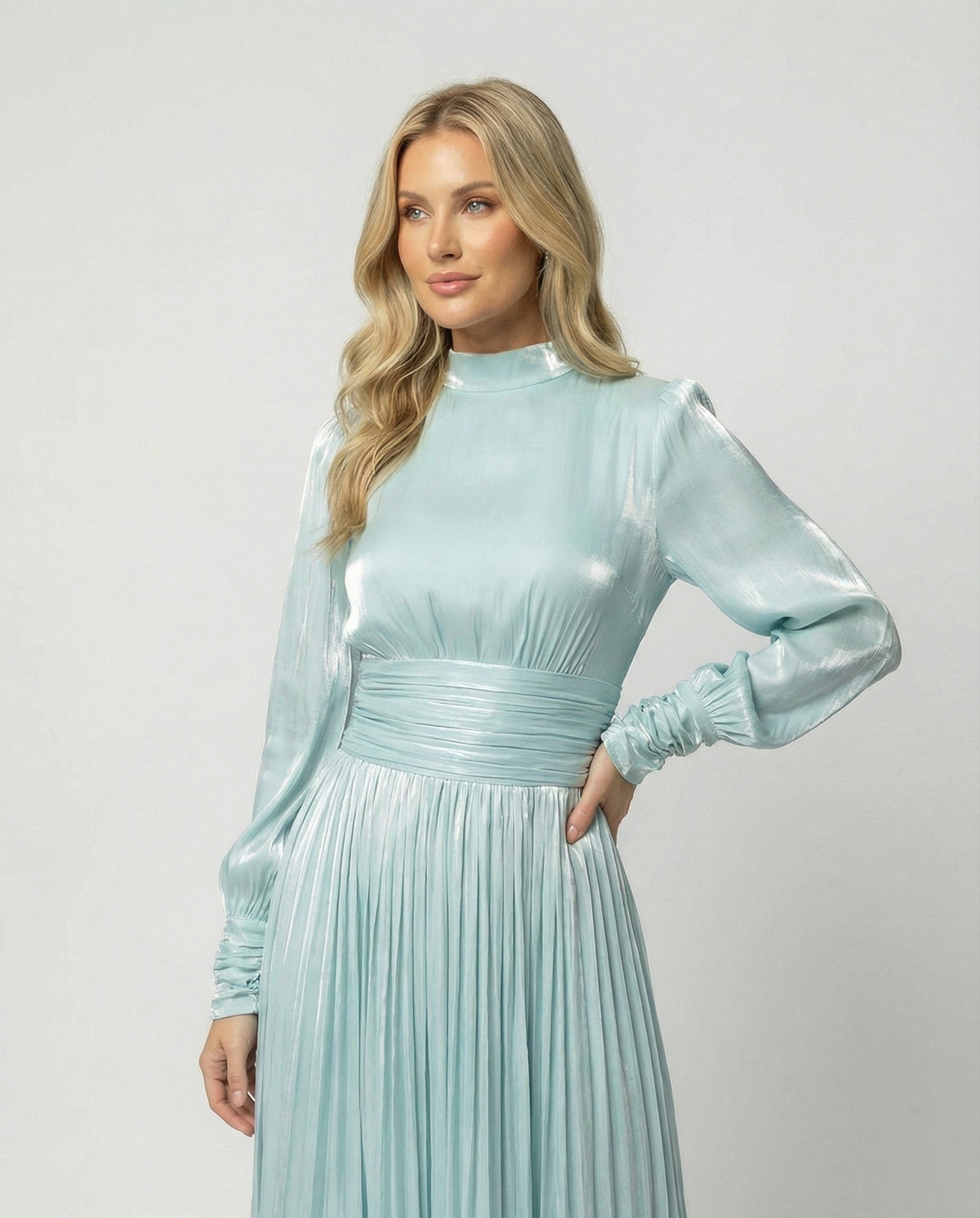 Maxi dress with ruching, pleats, cuffs, and a flared hem