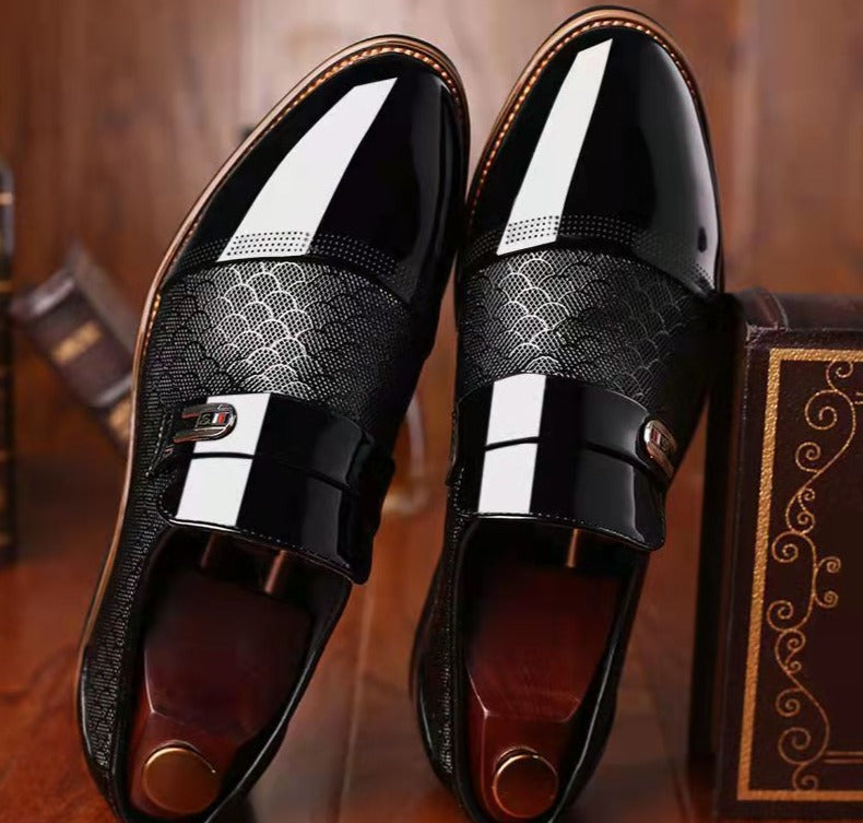 Glossy textured pointed brogues with a buckle and paneling