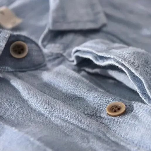 Loose short-sleeved shirt with cuffs, a collar, and a button