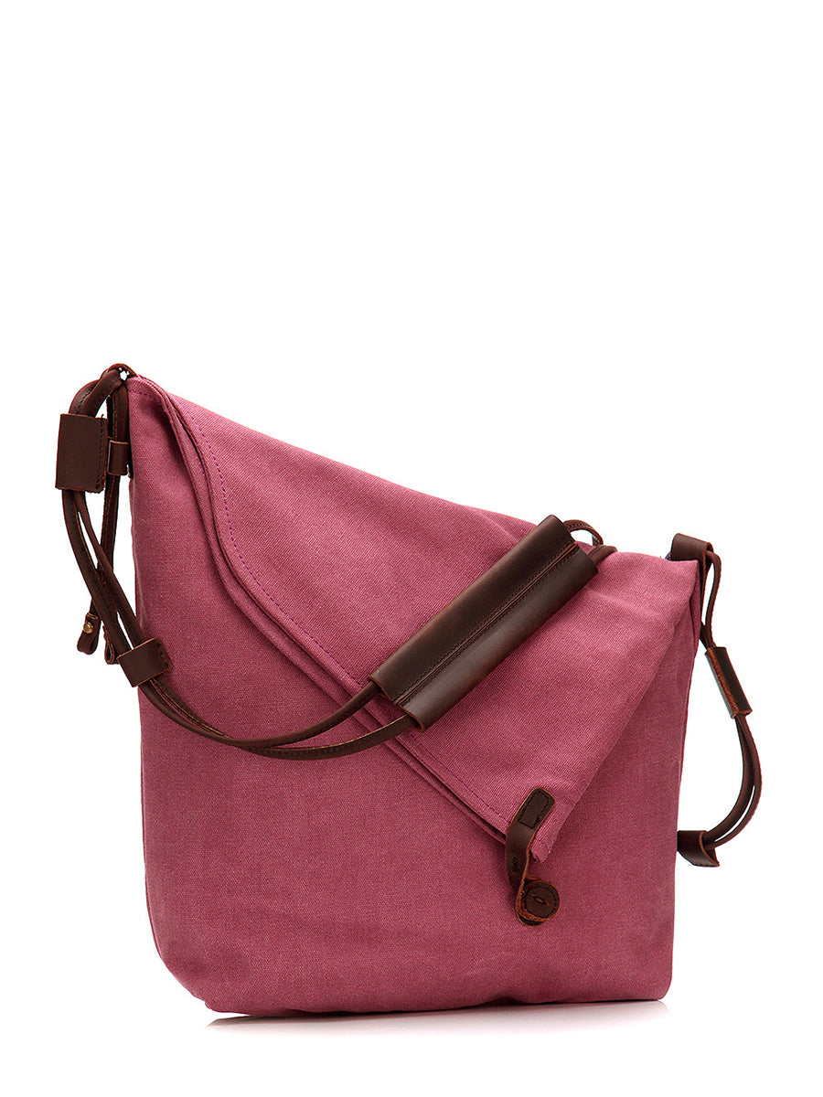 Asymmetrical folded bag with a button, adjustable and stitched