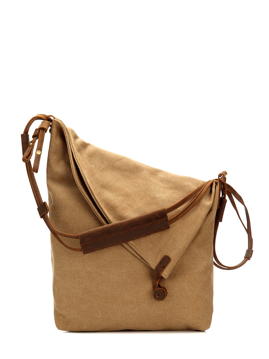 Asymmetrical folded bag with a button, adjustable and stitched