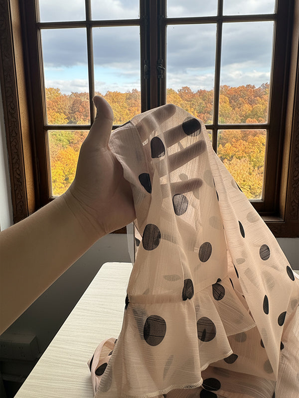 Blouse with a sheer collar and polka-dot ruffles