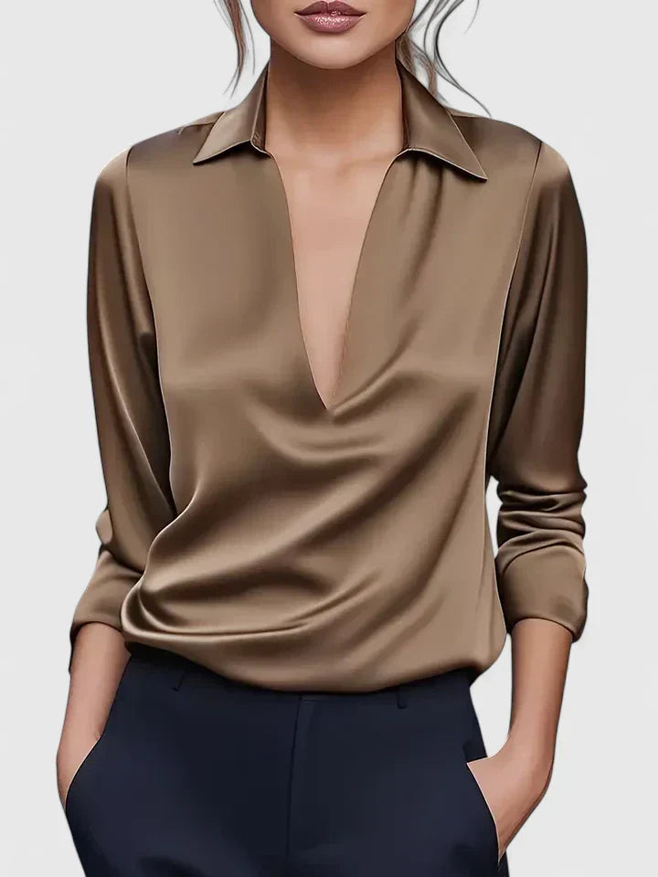 Solid-color V-neck top with draped sleeves and cuffs