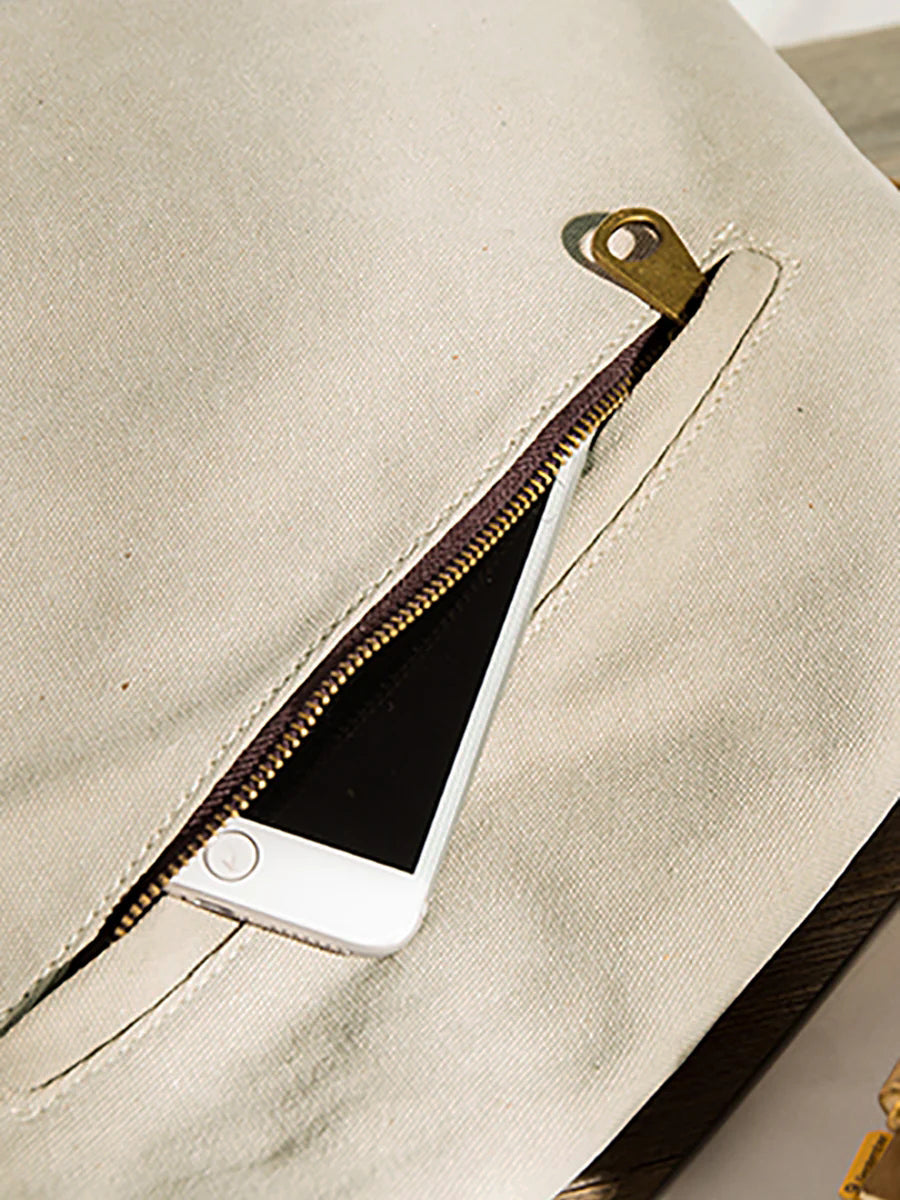 Asymmetrical folded bag with a button, adjustable and stitched