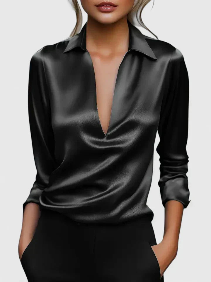 Solid-color V-neck top with draped sleeves and cuffs
