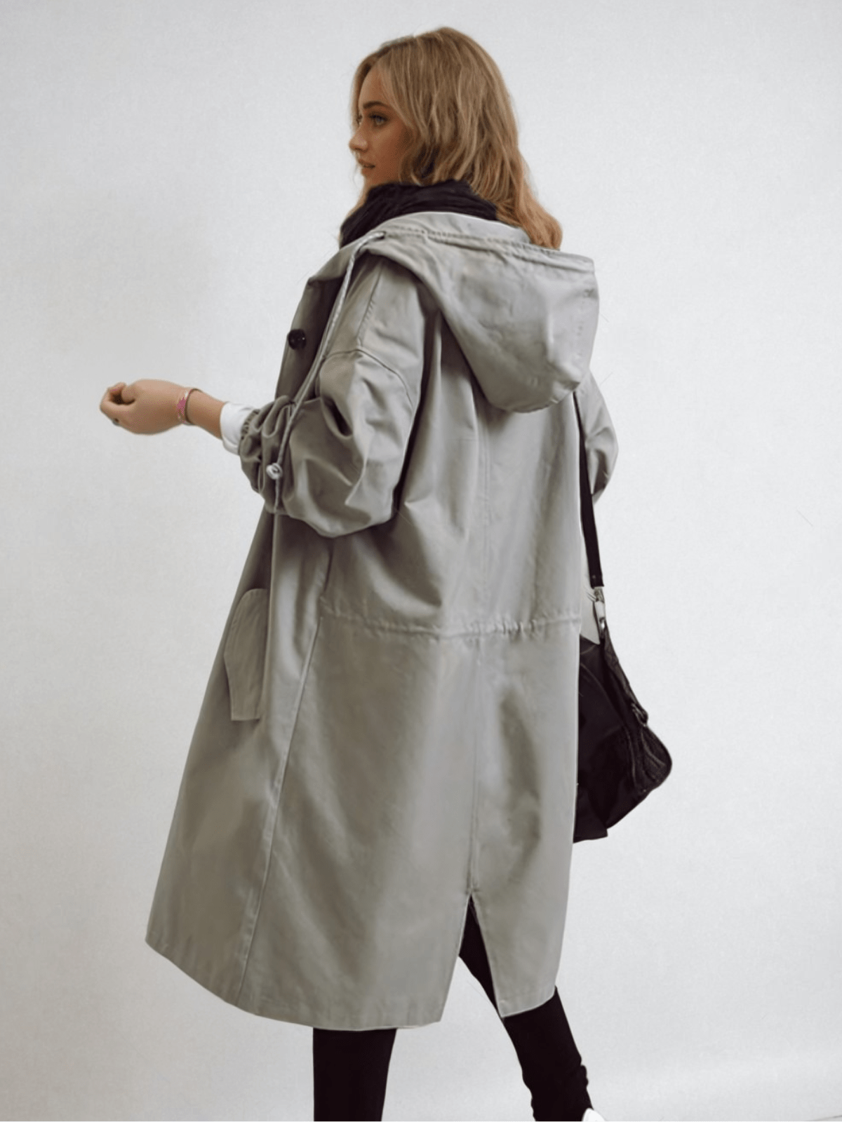 Hooded trench coat with button fastening and pockets