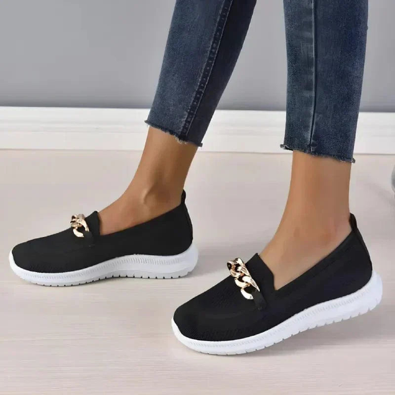 Slip-on shoes with a textured toe and chain detail