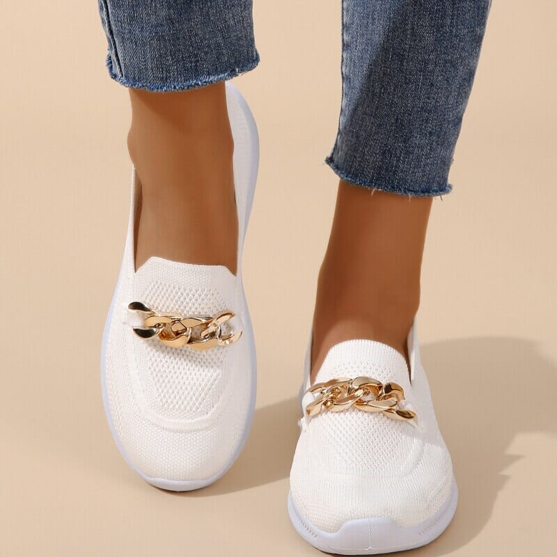 Slip-on shoes with a textured toe and chain detail