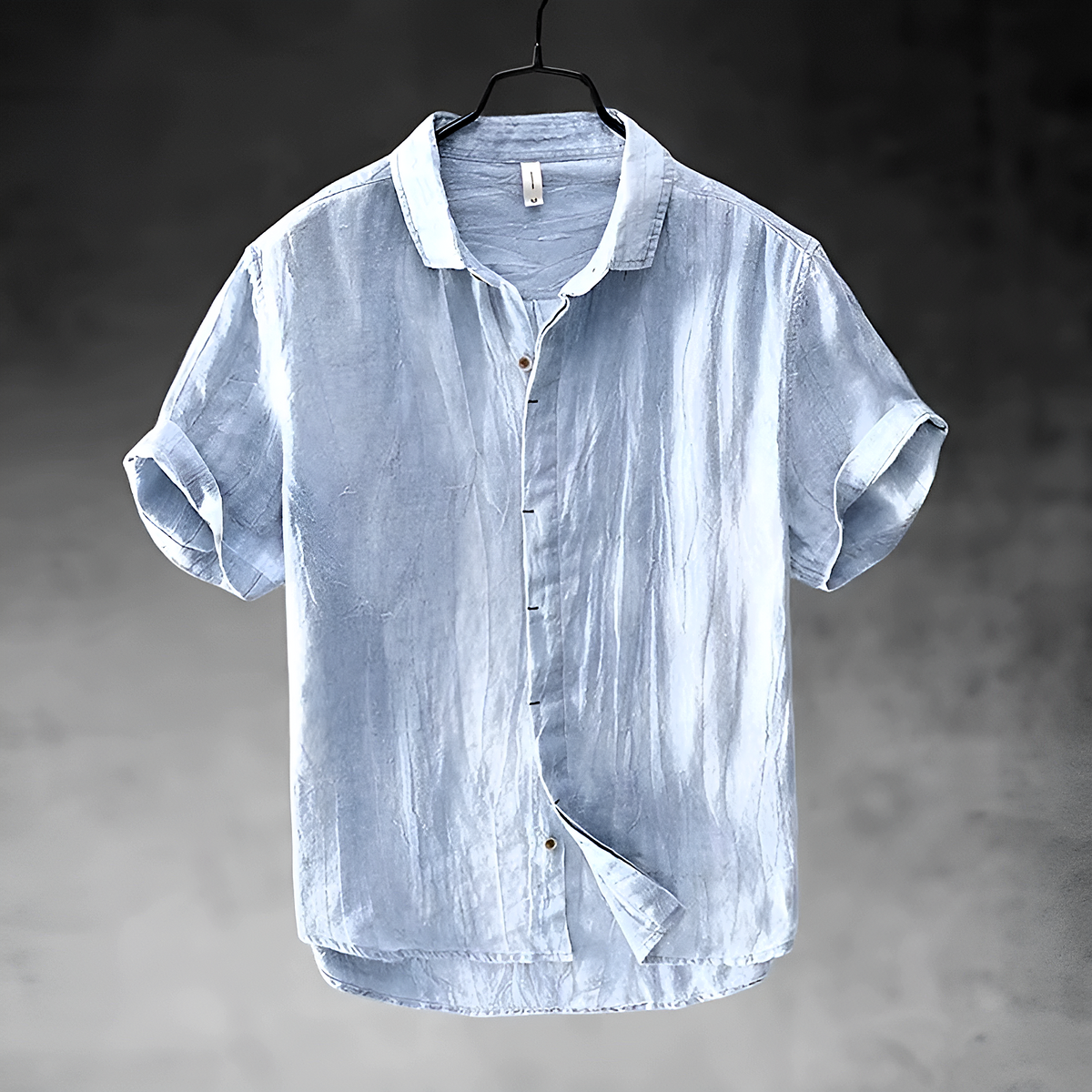 Loose short-sleeved shirt with cuffs, a collar, and a button