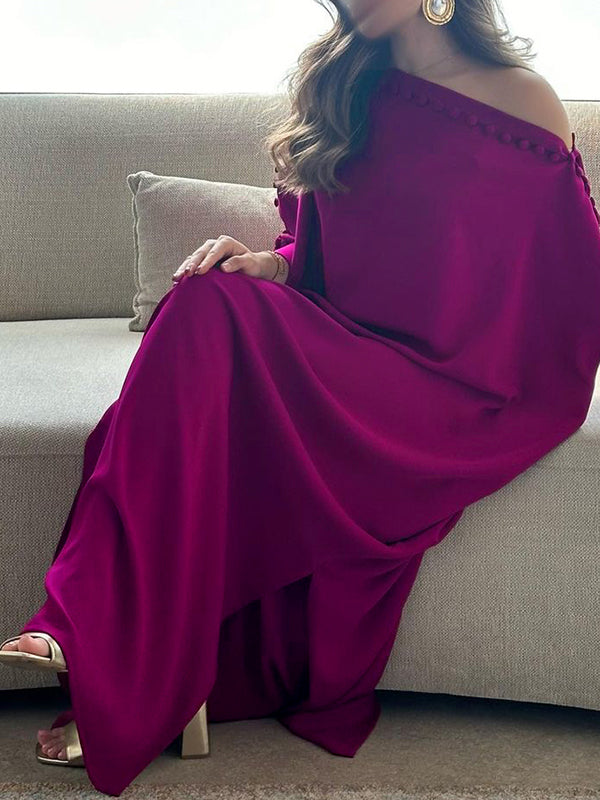 Maxi dress with an asymmetrical neckline and shoulder slit