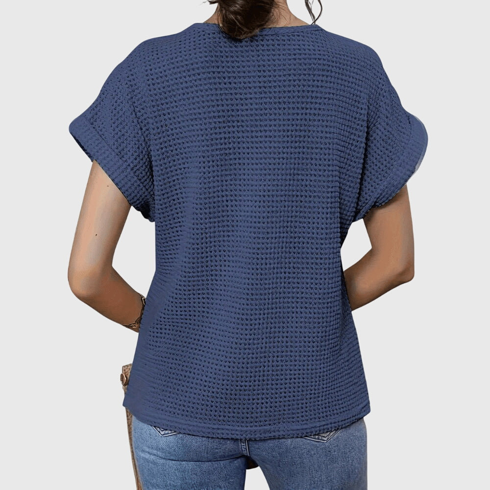 Textured perforated geometric loose top with rolled-up sleeves