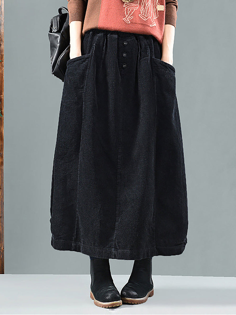 Long, wide, loose pleated skirt with buttons and pockets