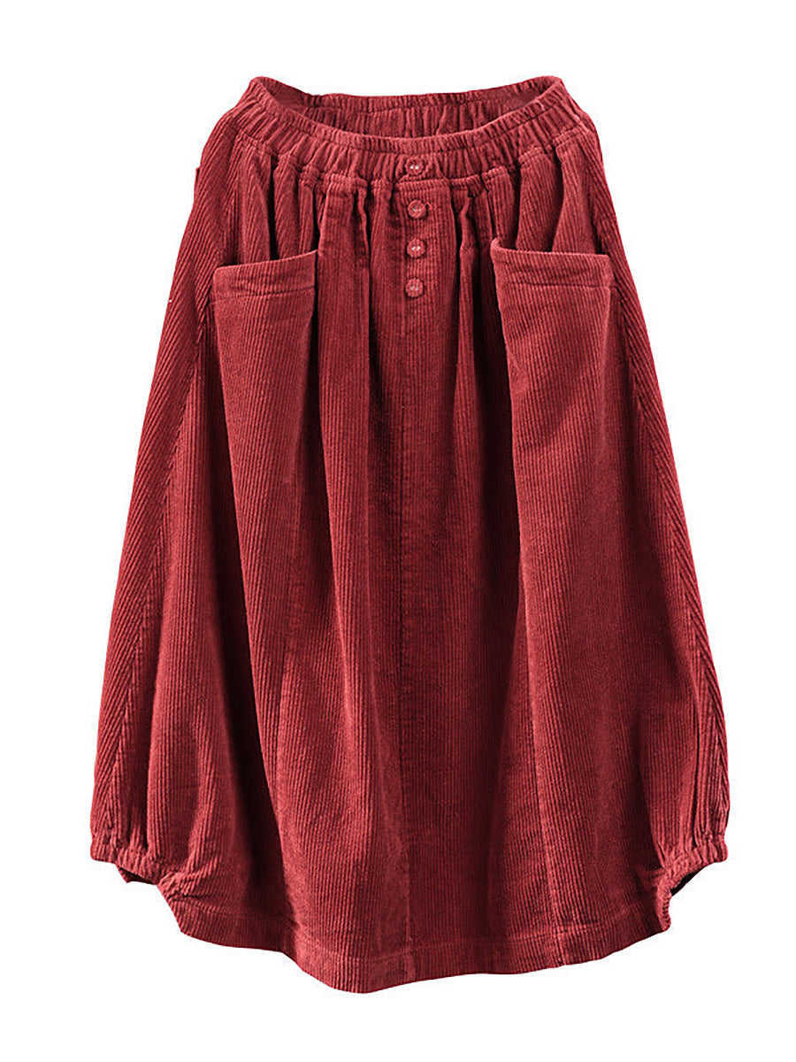 Long, wide, loose pleated skirt with buttons and pockets