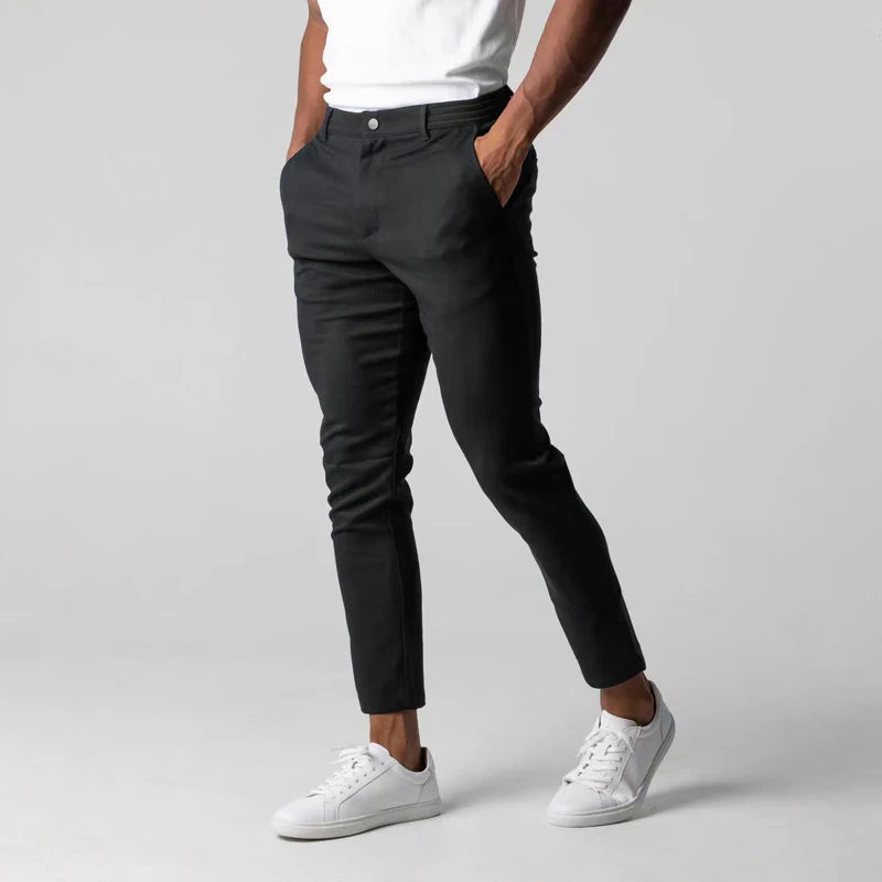 Spodnie z tapered slim, z kieszeniami, z guzikiem i wykończeniem na końcach