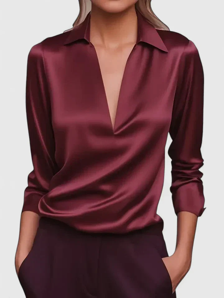 Solid-color V-neck top with draped sleeves and cuffs