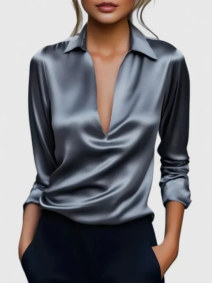 Solid-color V-neck top with draped sleeves and cuffs