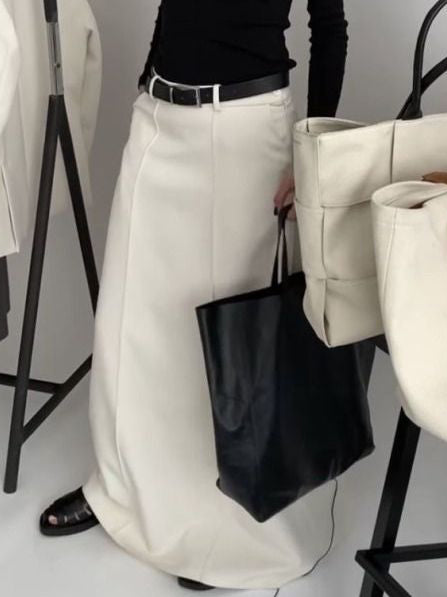 A-line maxi skirt with seam details and a belt