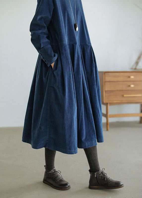 Loose pleated midi dress with a round neckline and long sleeves