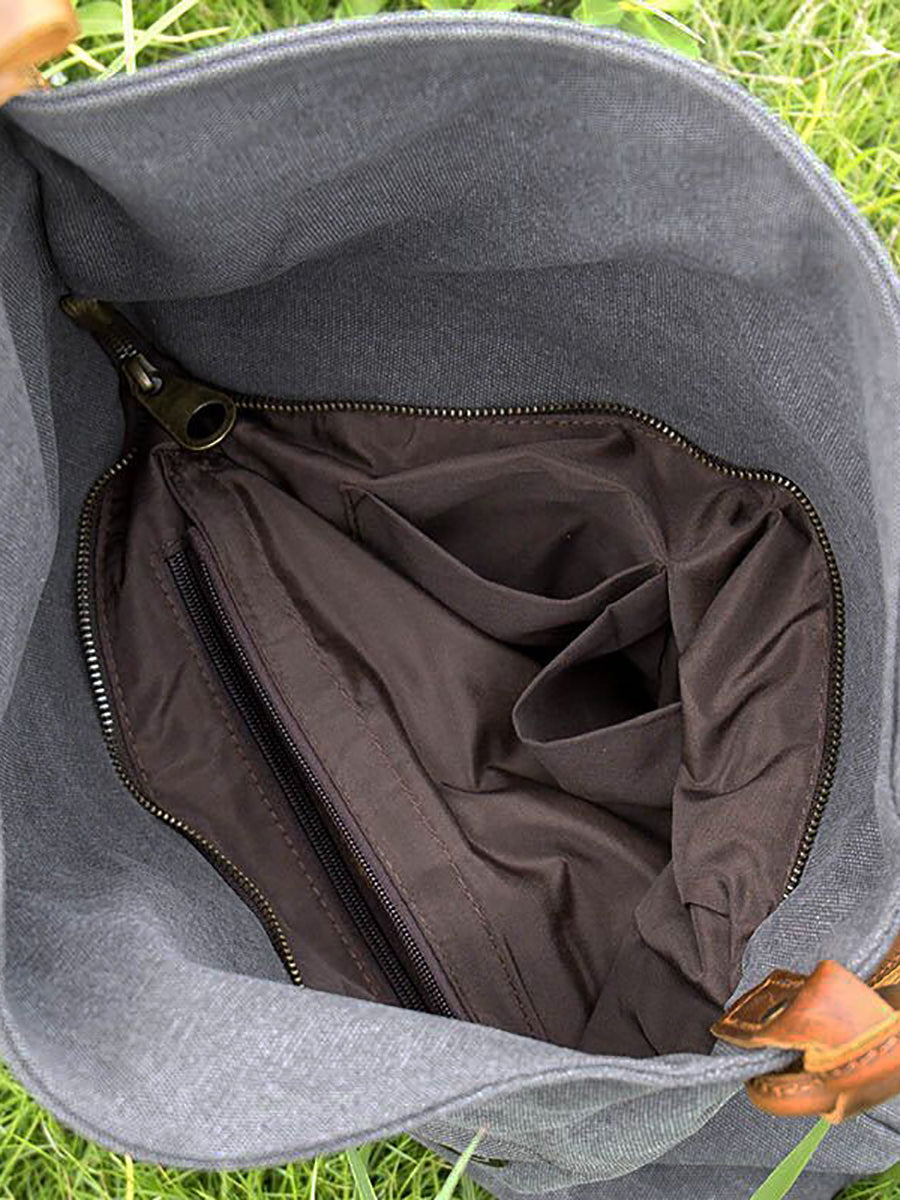 Asymmetrical folded bag with a button, adjustable and stitched