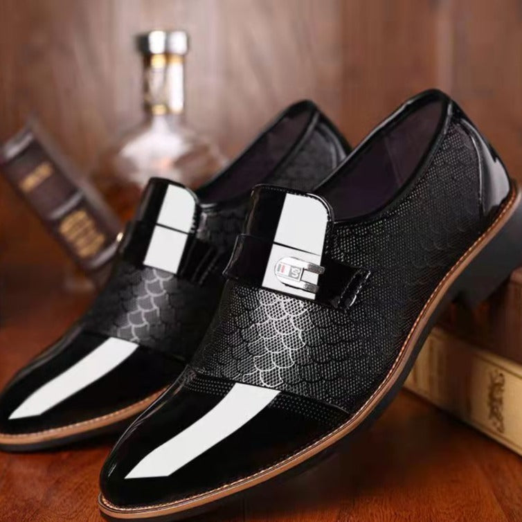 Glossy textured pointed brogues with a buckle and paneling