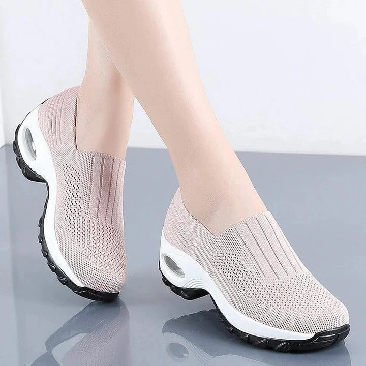 Slip-on shoes with a raised perforated upper
