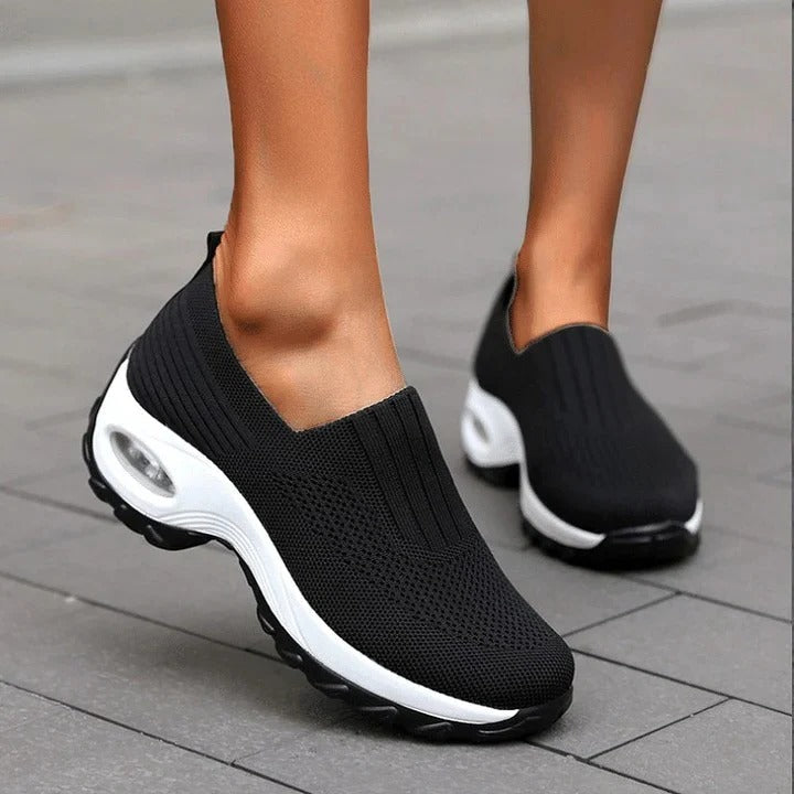 Slip-on shoes with a raised perforated upper