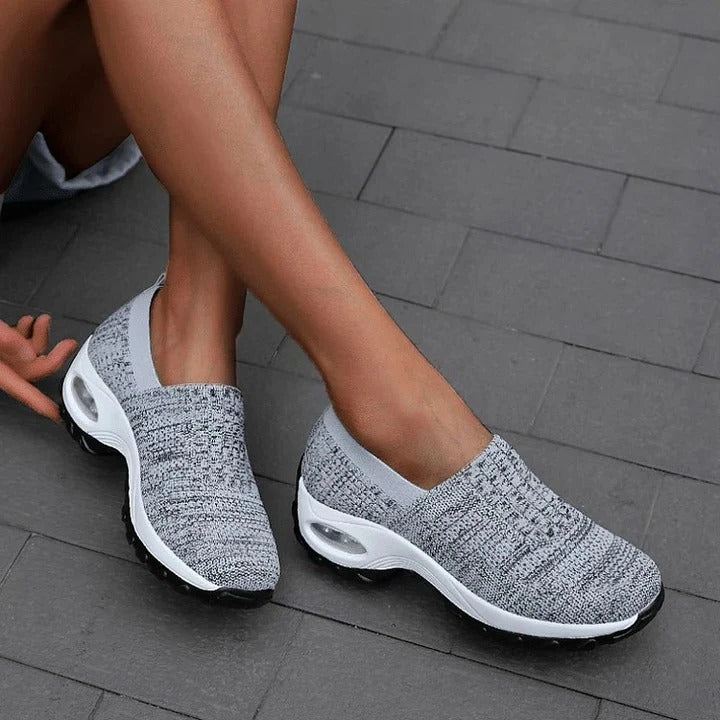 Slip-on shoes with a raised perforated upper
