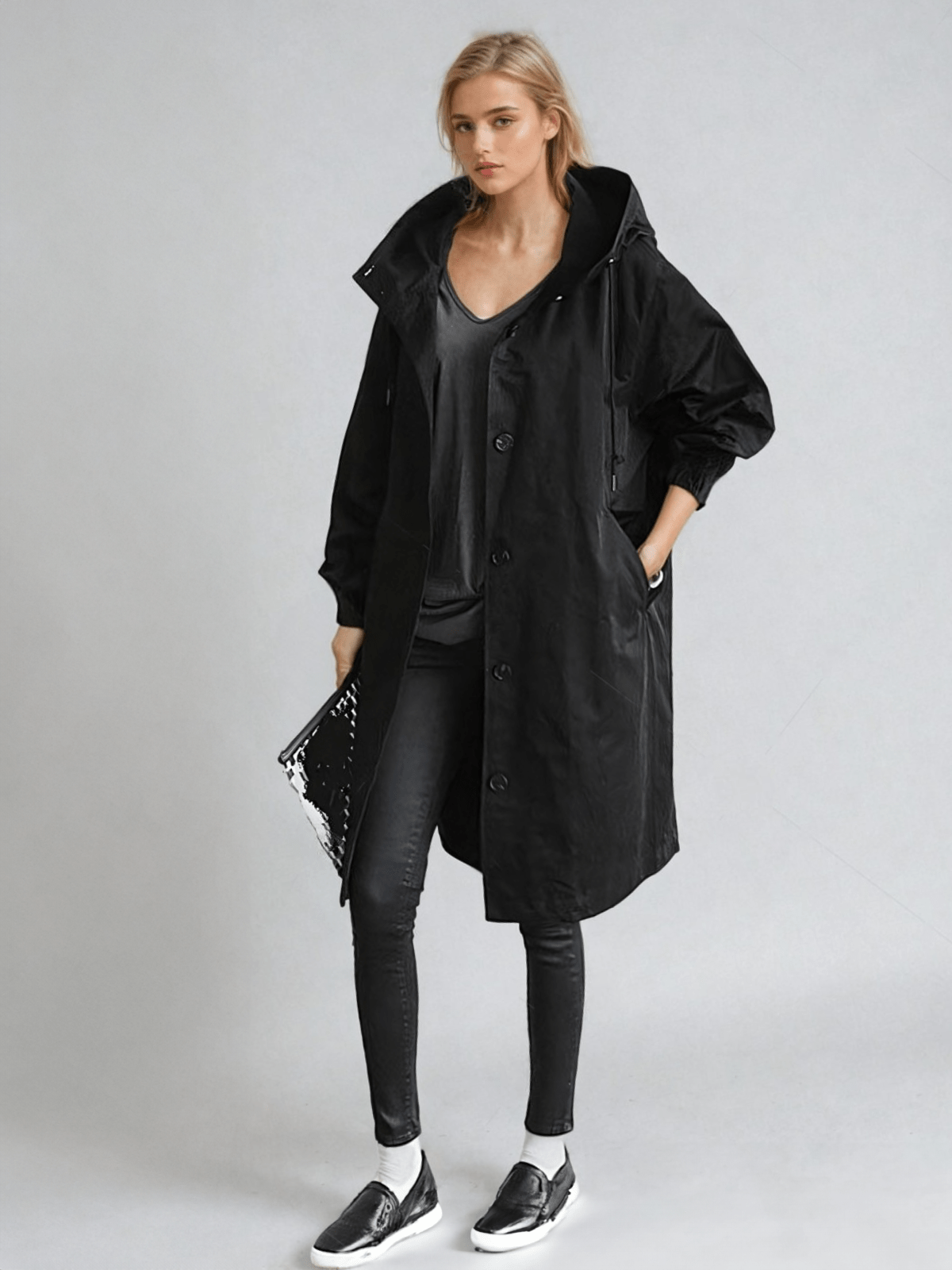 Hooded trench coat with button fastening and pockets